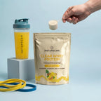 Clear Whey Protein Naturecan o smaku owoców tropikalnych z miarką odżywki białkowej